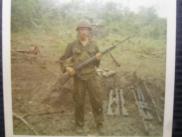 Me with captured weapons during the recon in which Santa cruz was killed -DP28 and other weapons
